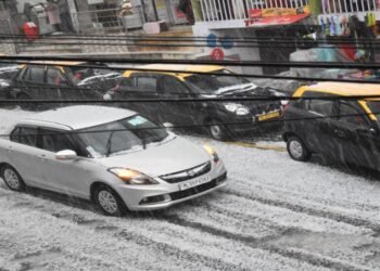 In Pics : Rain and hailstones slow down traffic in Shillong