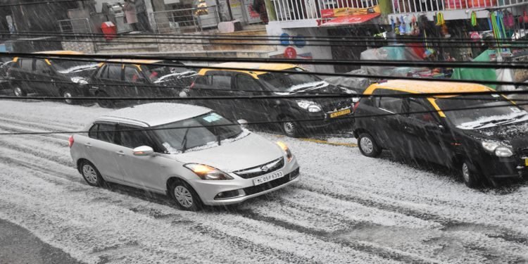 In Pics : Rain and hailstones slow down traffic in Shillong