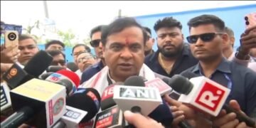 Assam CM flashes development card